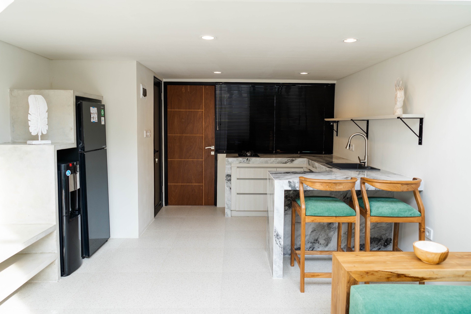 Kitchen wider view with bar stools